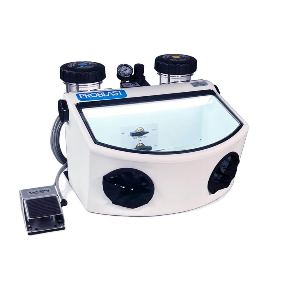 A white industrial micro sandblaster with two tanks and a clear viewing window on the front.