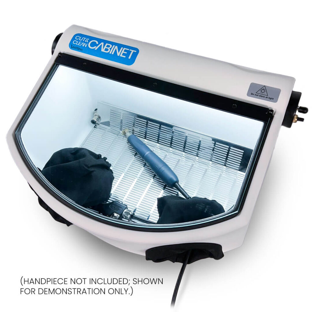 A Cut & Clean cabinet with a transparent glass window, showing a dental handpiece inside (handpiece not included).