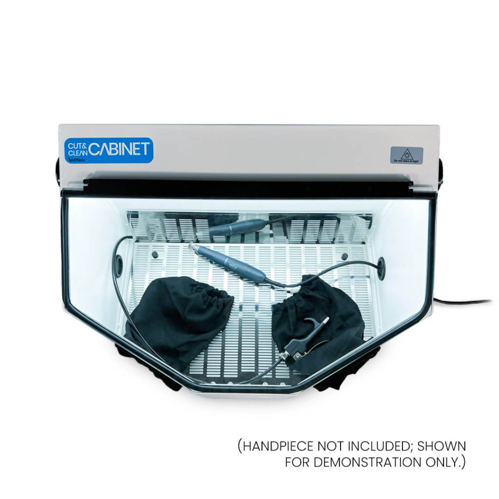 Vaniman Cut & Clean XL (top-down view). A handpiece is shown in the cabinet for demonstration.