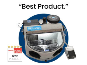 A professional dental sandblasting machine made by Vaniman Manufacturing, with pressure gauges, dials, and hoses.