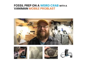 Man with beard standing in a workspace with various tools and equipment, including a Vaniman mobile dust blaster