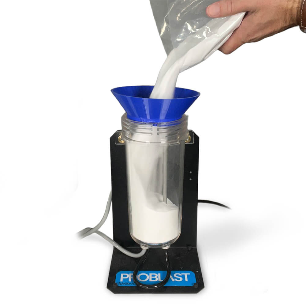 Filling Vaniman Mobile Problast tank with abrasive media using blue funnel – Part Number 97998.