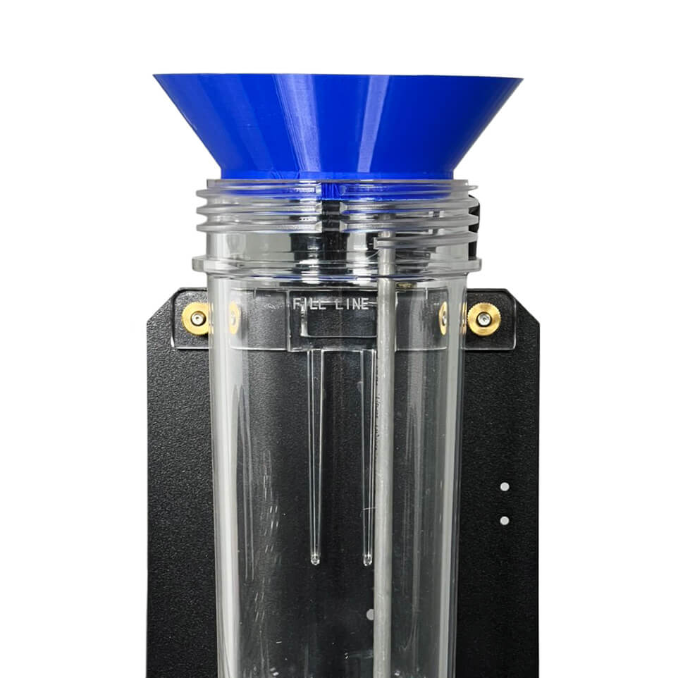 Close-up of Vaniman tank funnel (PN 97998) seated on blaster tank, showing proper fill line and blocked manifold tube.