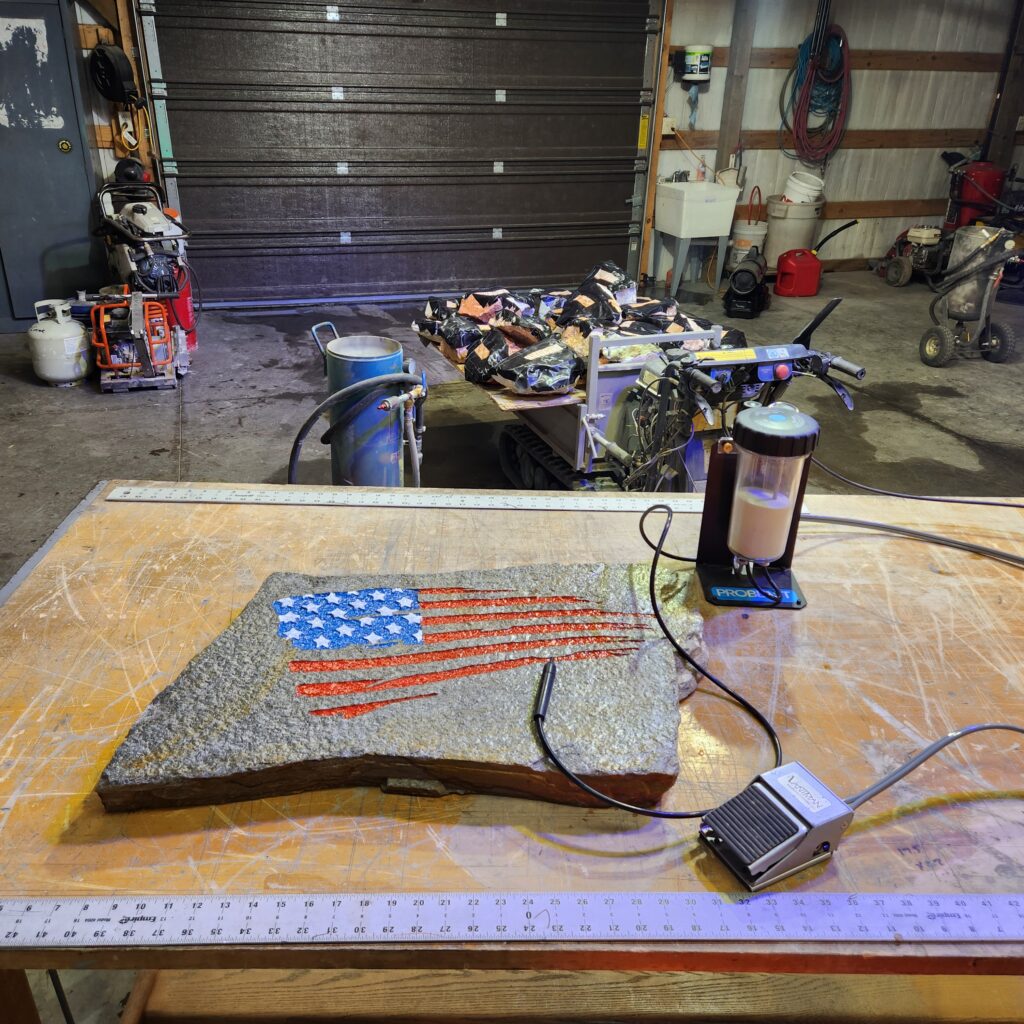 USA flag engraving next to a Vaniman Mobile Problast