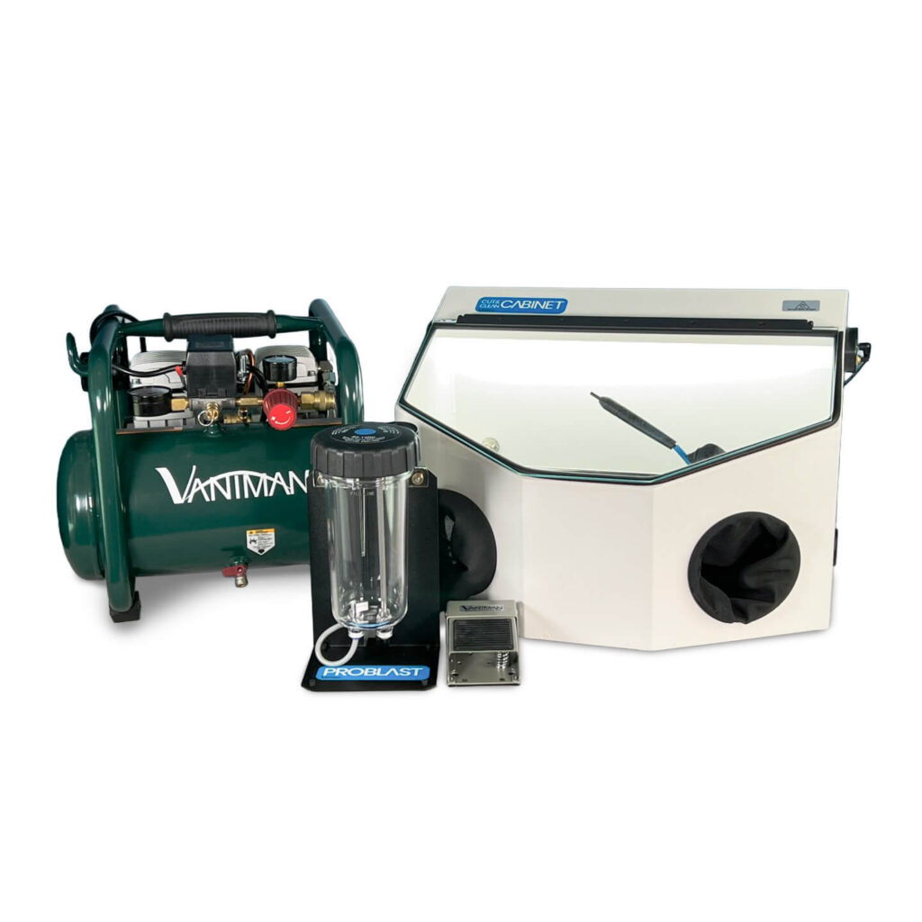 A Vaniman air compressor with a Mobile Problast sandblaster and a Cut & Clean XL cabinet.